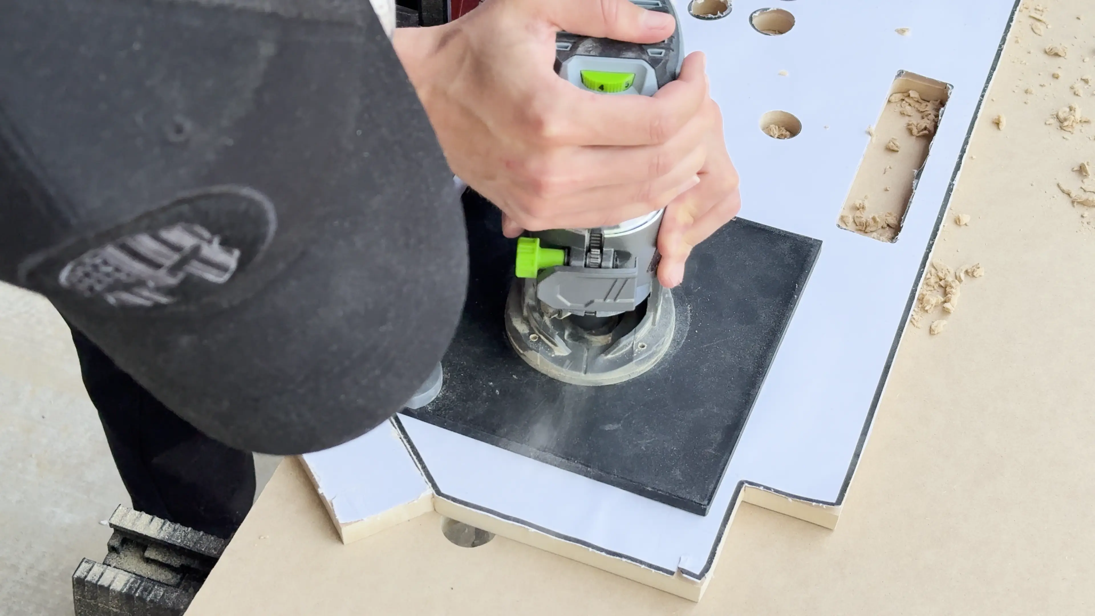 Me watching very closely as the flush trim bit rides along the inside of my 3D printed router jig.