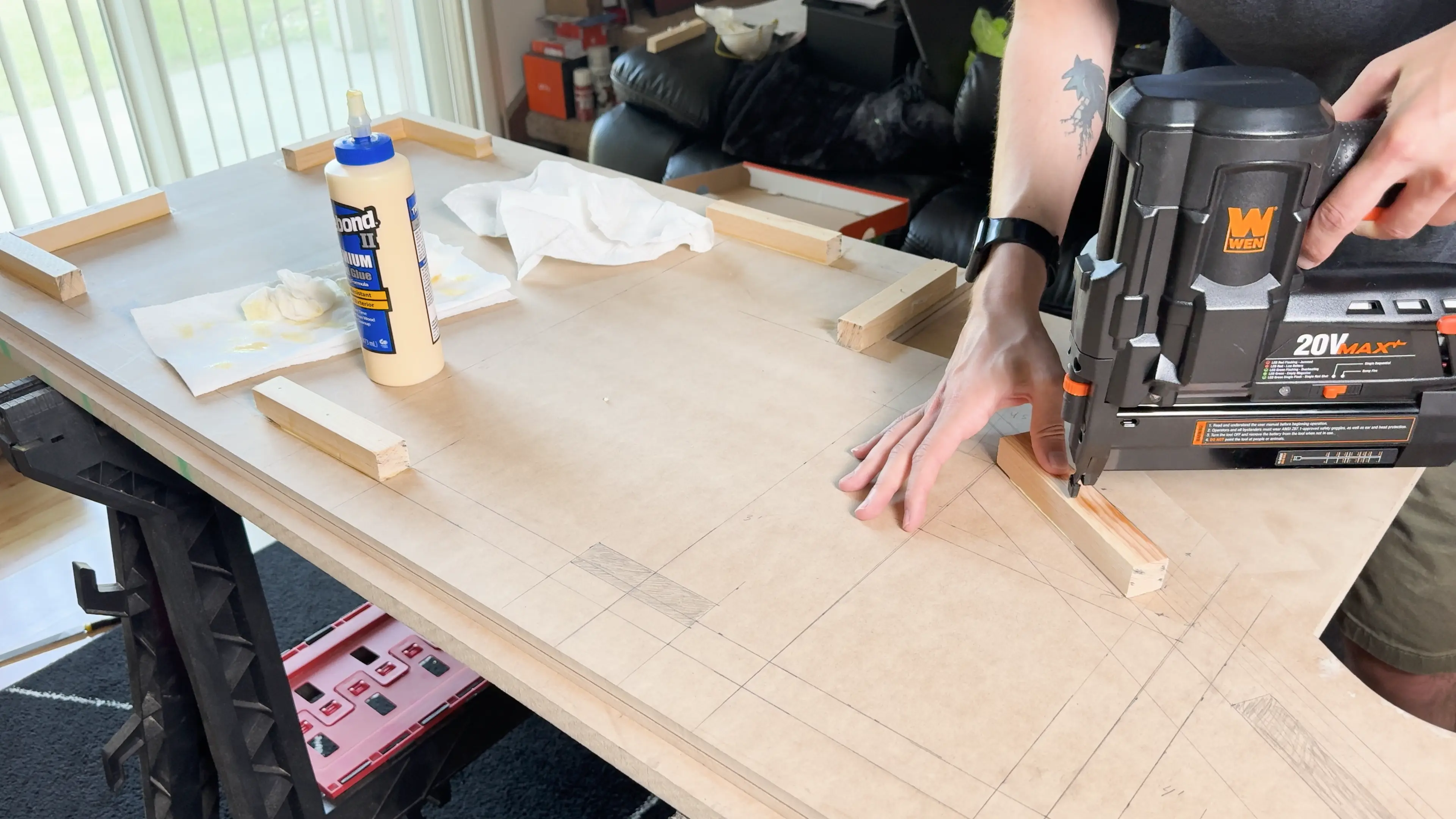 Using the brad nailer to secure the gluey cleats.