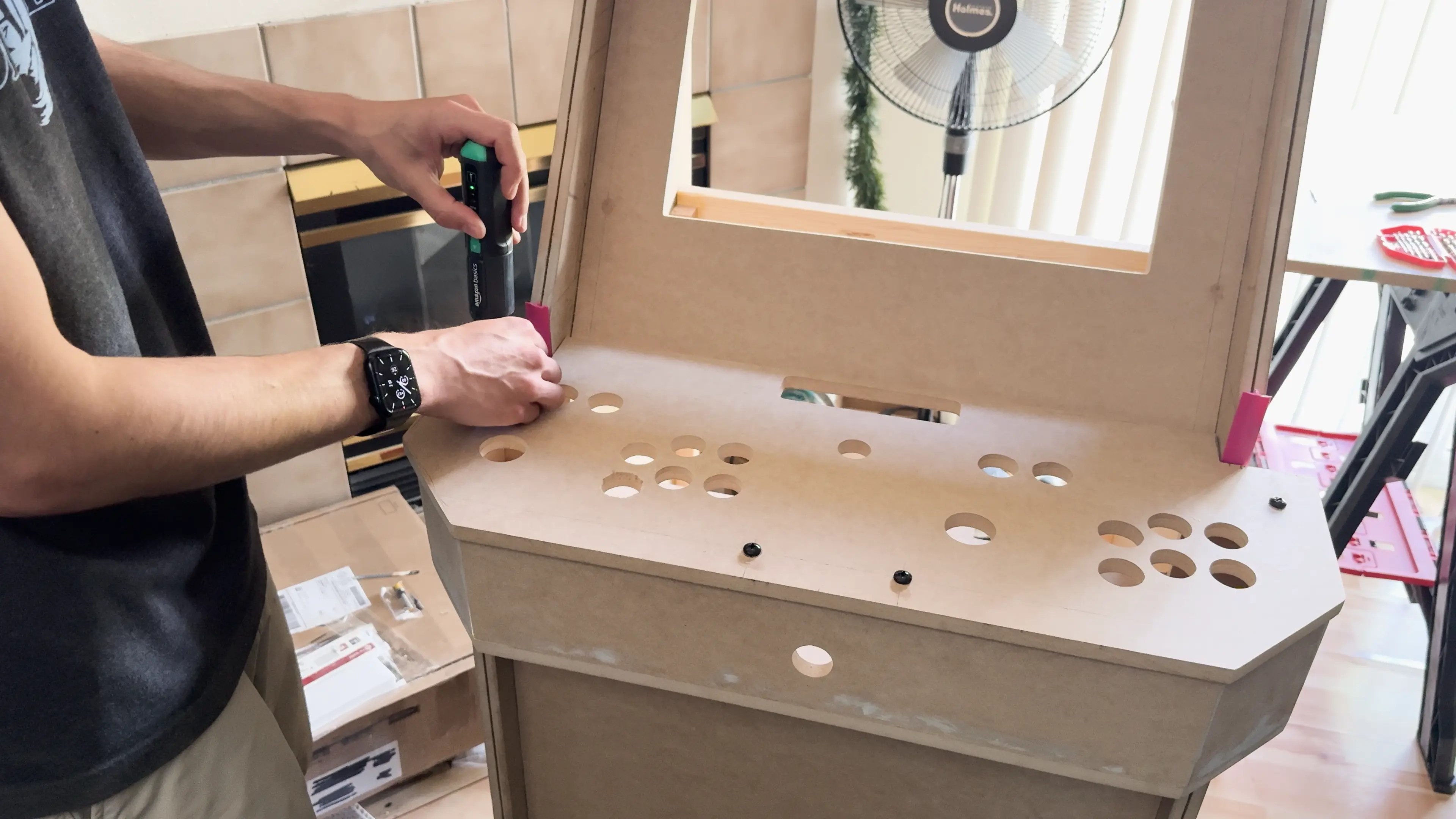 Torquing the attachment bolts for the control panel top.