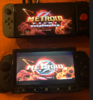 Wii Nexigo portable Next to a Switch OLED.PNG